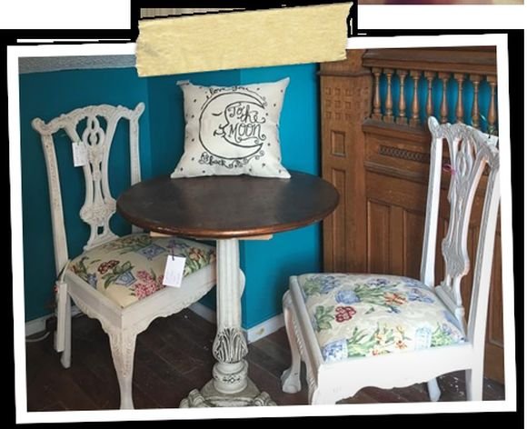 A painted teal sideboard with upholstered chairs